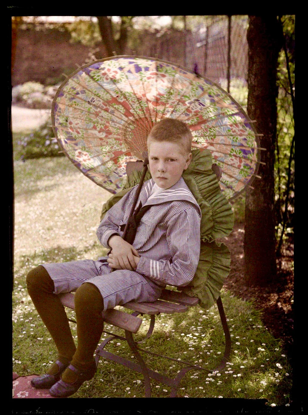 Boy with a parasol by an anonymous photographer, c. 1910. Source: Science and Media Museum, Bradford