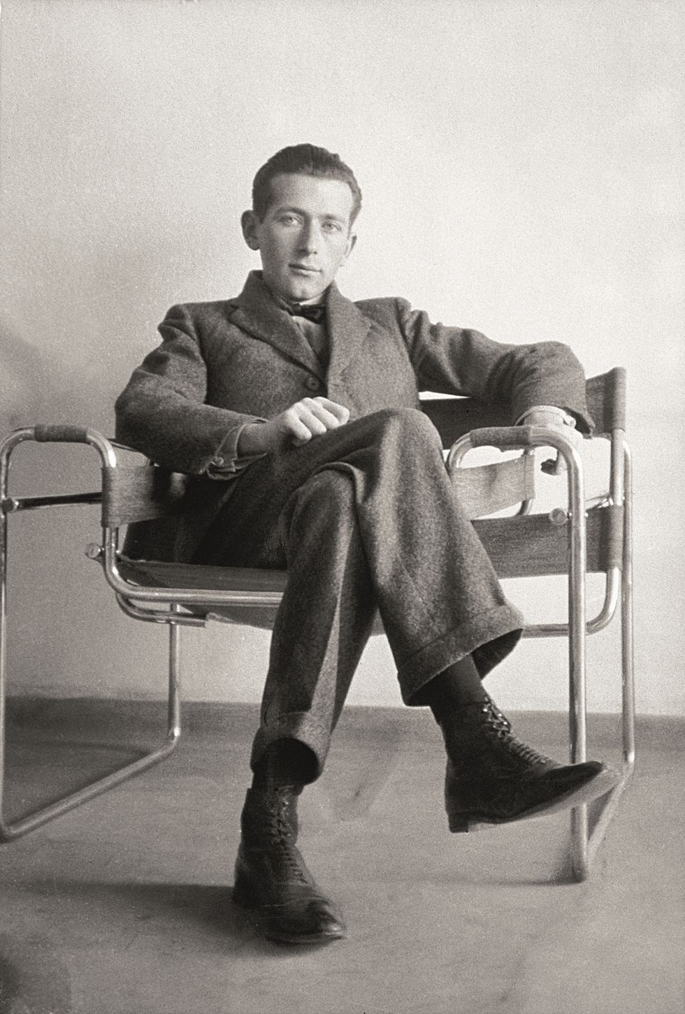 Photograph of the young Marcel Breuer, seated in a Wassily Chair